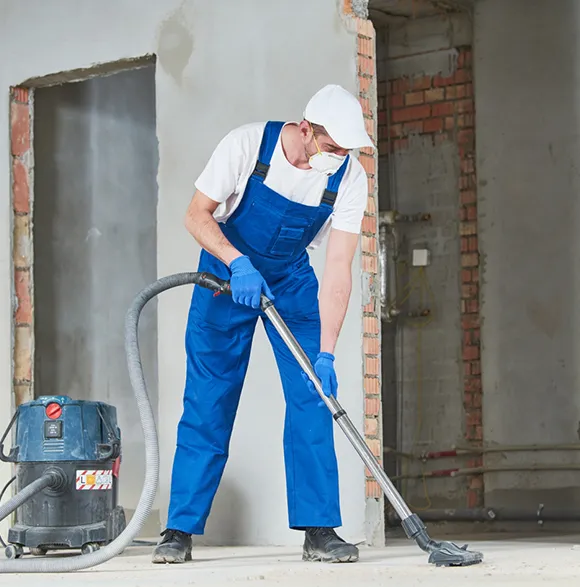 Cleaning professional vacuuming floor at a post construction site in Kalamazoo MI.