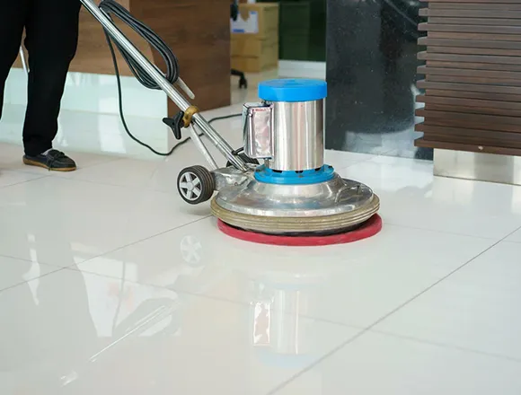 Professional stripping VCT tile floor with a floor machine in Kalamazoo MI.