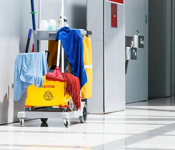 Janitorial cart with cleaning supplies in an office building in Ann Arbor MI.